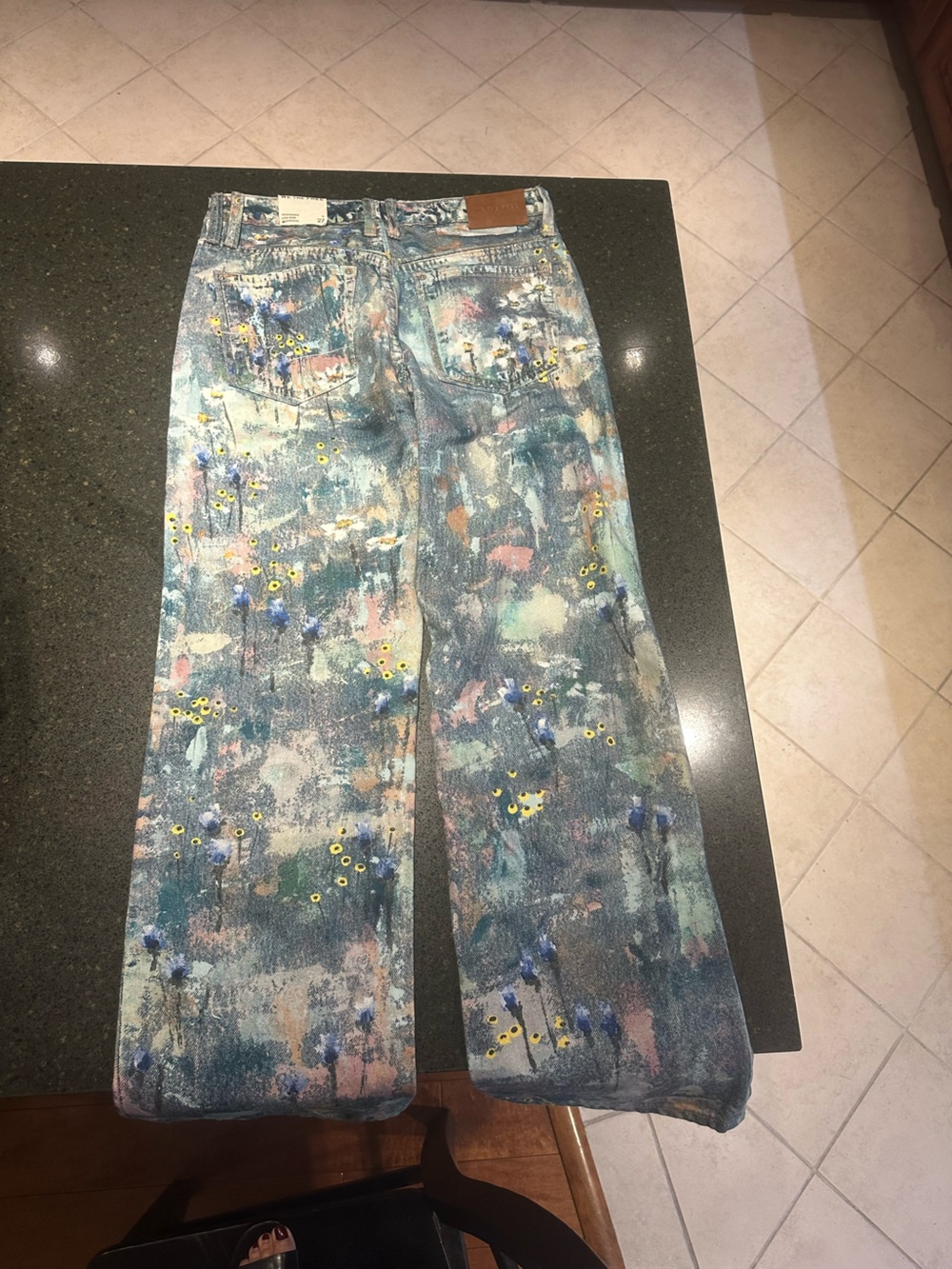We The Free Tennessee, low rise, boyfriend cut illusions floral jeans.